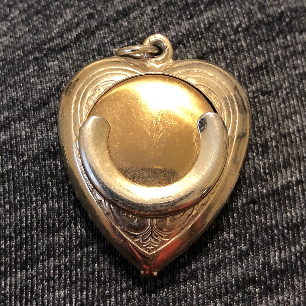 Vintage gold tone heart shaped coin holder pendant